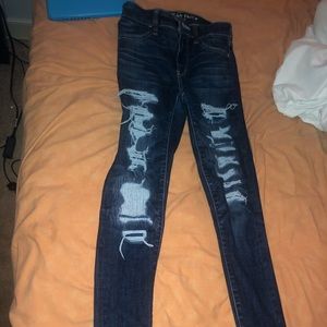 Dark washed distressed jeans